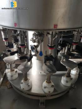 M�quina rotativa de llenado y tapado Arbr�s