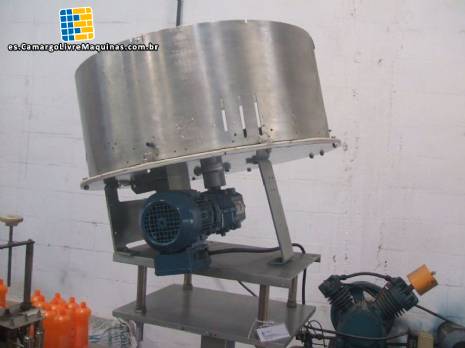 Alimentador de tapas y rotaci�n del posicionador