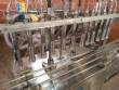 M�quina de llenado al vac�o con 12 boquillas