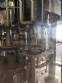 M�quina de llenado rotativa Zegla con sistema de enjuague y taponado de tres bloques