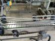 Elevador de posicionamiento y llenado de tapas para la industria de maquinaria SLP